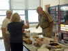 Kaye Boyer Vassilos, (back) Laura McGee Buonarobo, Paul Dunning scoping out food.